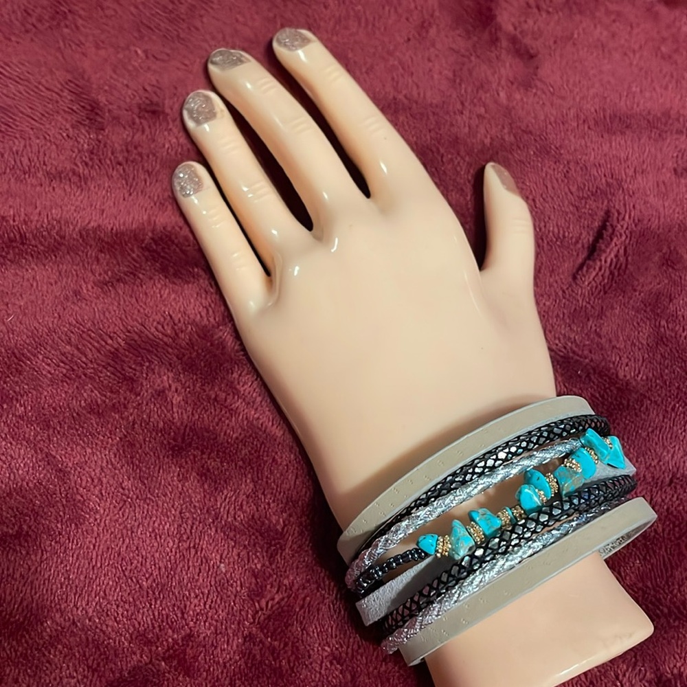 8 stranded rope bracelet- 3 of the strands look like faux leather